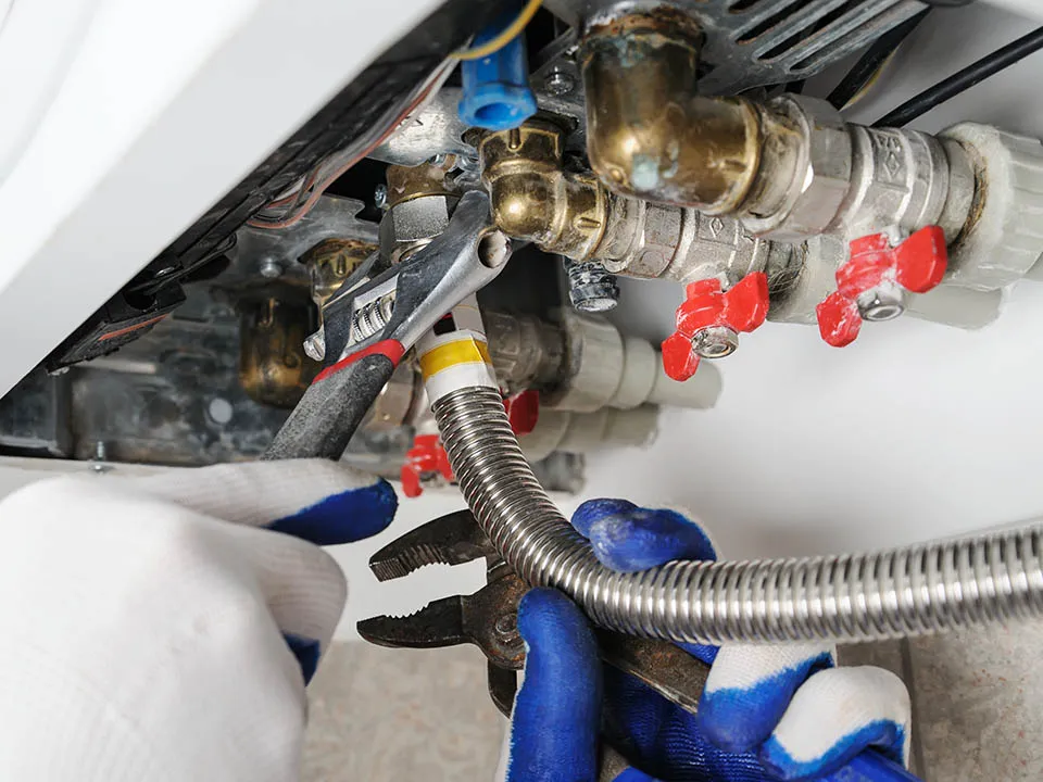 Technician working on a boiler